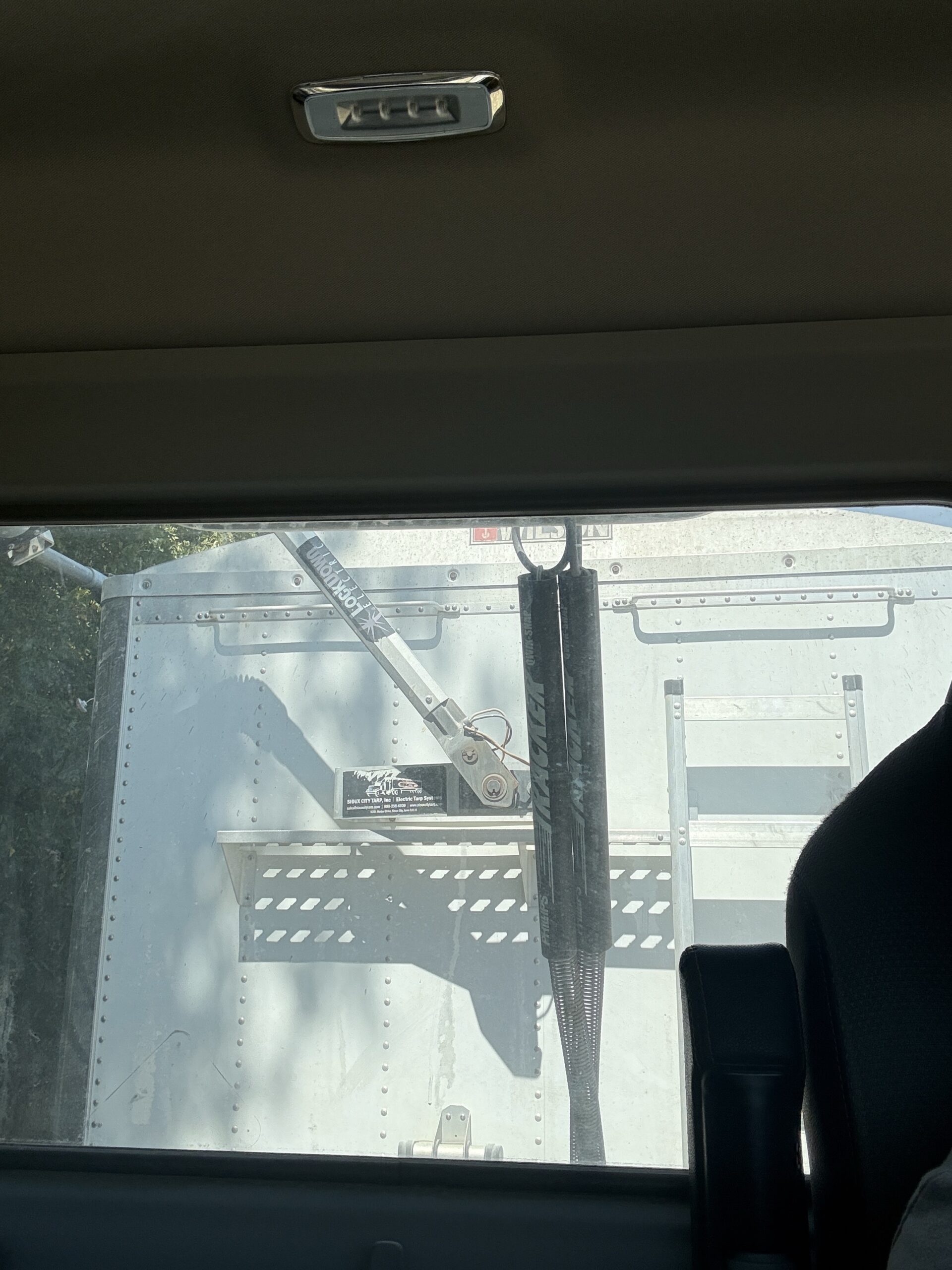 Back glass view from inside the 18 wheeler truck cab