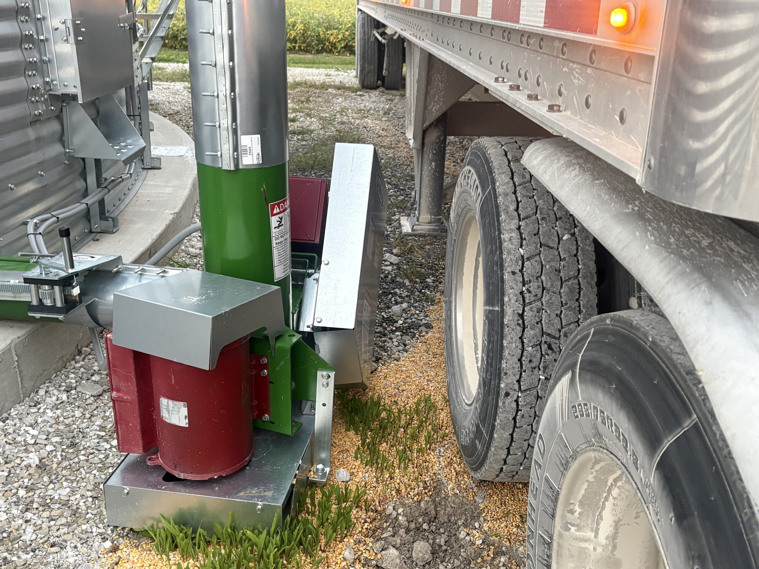Tractor trailer close to grain bin to get loaded with grain